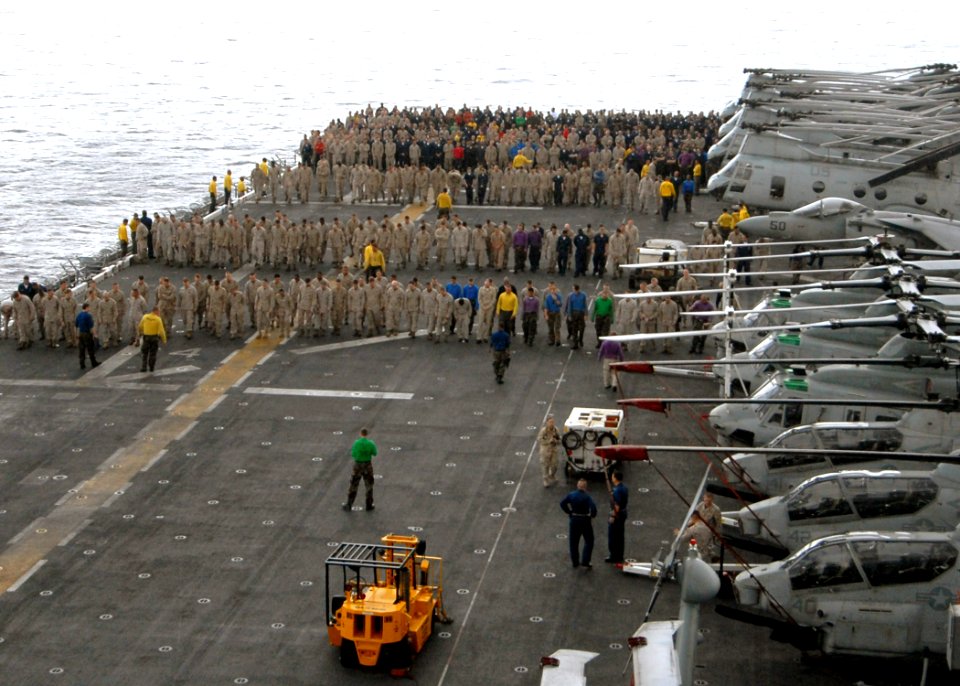 US Navy 090504-N-8283S-021 INDIAN OCEAN (May 4, 2009) Sailors and Marines perform a foreign object debris (FOD) walk down after an all-hands call aboard the amphibious assault ship USS Boxer (LHD 4)