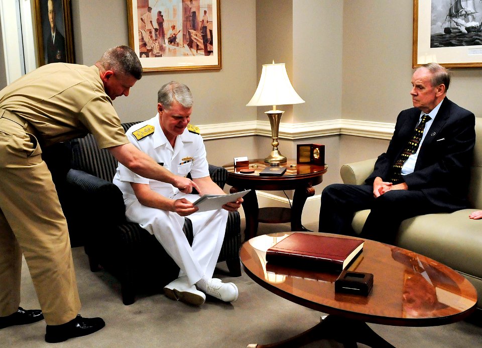 US Navy 090505-N-8273J-030 Master Chief Petty Officer of the Navy (MCPON) Rick West, left, and Chief of Naval Operations (CNO) Adm. Gary Roughead look over photos from the 1959 U.S. Navy Ceremonial Guard