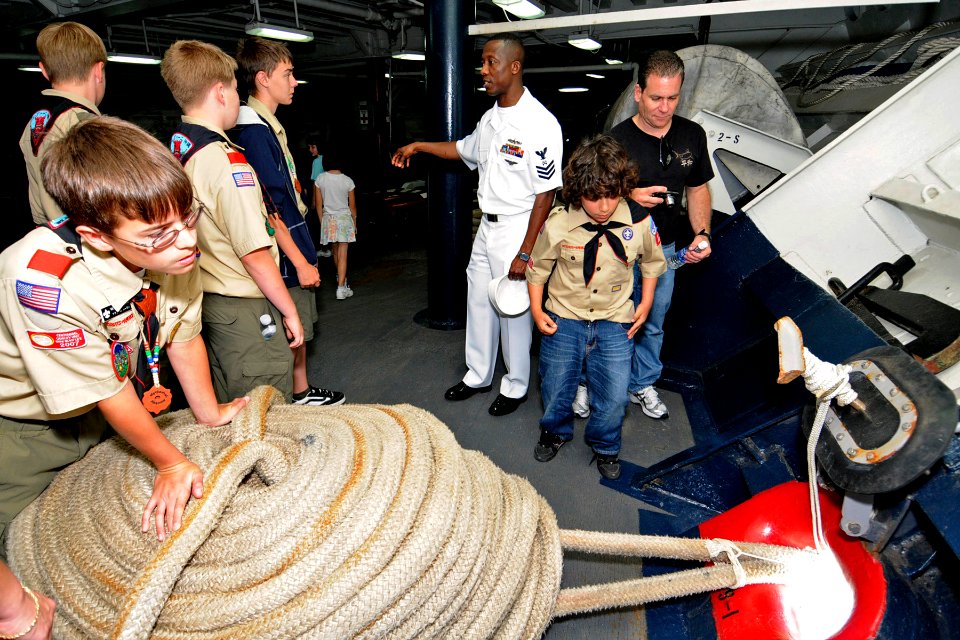 US Navy 090503-N-7478G-050 torekeeper 1st Class Yahah Sesay, assigned to the amphibious command ship USS Blue Ridge (LCC 19), explains the mooring line in the foc'sle