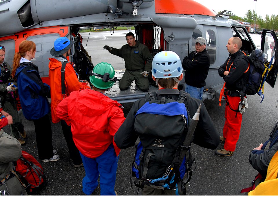US Navy 090505-N-9860Y-002 Naval Aircrewman 1st Class Chad Lewis, from Naval Air Station Whidbey Island Search and Rescue, briefs Bellingham Mountain Rescue Council volunteers on hoist operations