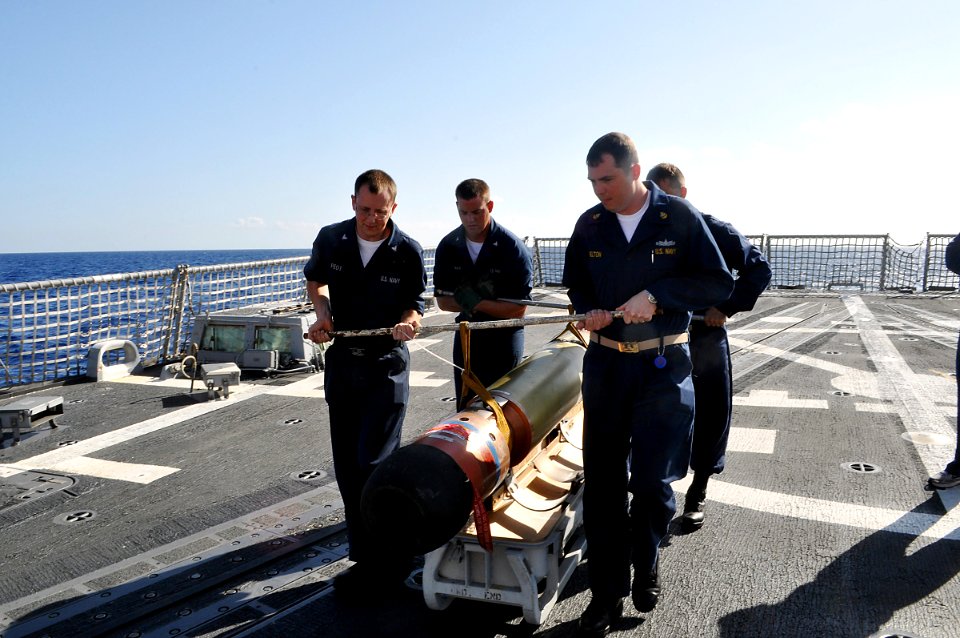 US Navy 090505-N-4124C-001 Sailors aboard the guided-missile destroyer USS Forrest Sherman (DDG 98) handle a REXTORP for use during a live-fire anti-subsurface warfare exercise