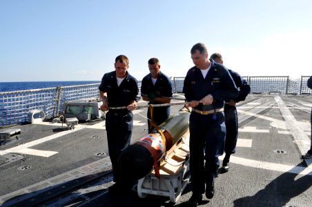 US Navy 090505-N-4124C-001 Sailors aboard the guided-missile destroyer USS Forrest Sherman (DDG 98) handle a REXTORP for use during a live-fire anti-subsurface warfare exercise