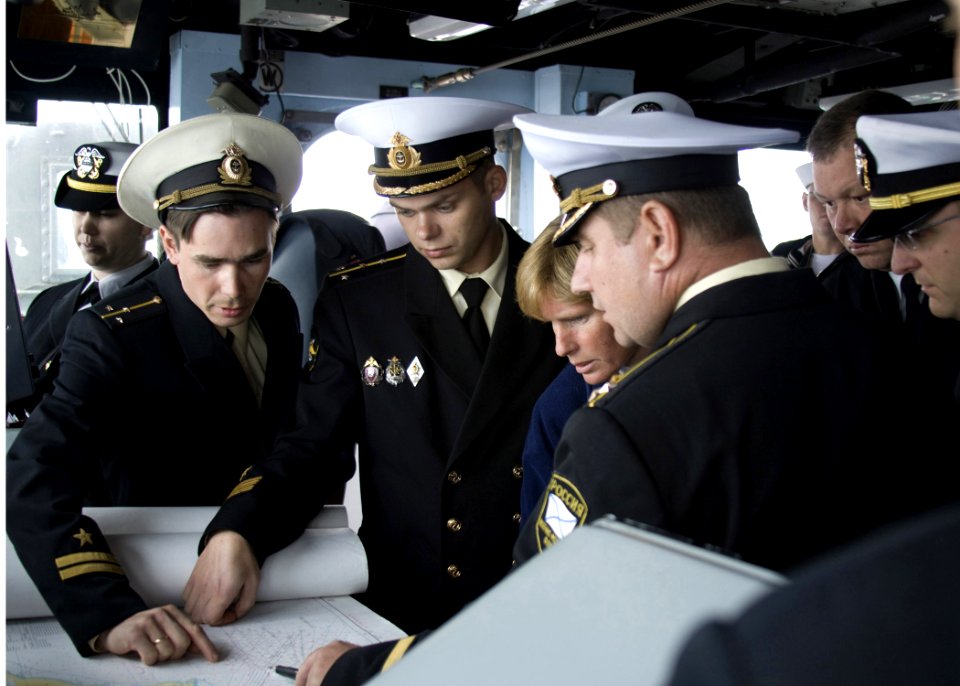 US Navy 090507-N-3134M-029 Capt. Holly Graf and Capt. 1st Rank Podkopaylo Petr Aleksandrvich look on as Russian naval officers plot a course into the harbor surrounding Vladivostok