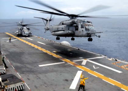 US Navy 090504-N-9950J-141 Aviation Boatswain's Mate (Handling) Seaman Emily McCann, of Redlands, Calif., and Aviation Boatswain's Mate (Handling) 3rd Class Lois Braxton, of Brooklyn, N.Y., direct the launch of a CH-53E Sea Sta