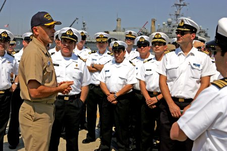 US Navy 090507-N-7441H-001 Cmdr. Troy Jackson, commanding officer of attack submarine USS Norfolk (SSN 714), greets a group of naval officers from Chile, Argentina and Spain arriving for a tour aboard the nuclear submarine