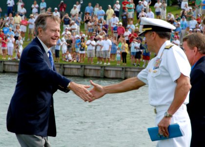 US Navy 090506-N-0486G-003 Former President of the United States George H. W. Bush shakes hands with Rear Adm. Joseph Kernan, commander, U.S. Naval Forces Southern Command and U.S. 4th Fleet on the 18th green at TPC Sawgrass