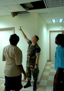 US Navy 090507-F-7923S-012 Navy Lt. Brent Levingston, the industrial hygiene officer embarked aboard the Military Sealift Command hospital ship USNS Comfort (T-AH 20), explains the importance of ventilation to Antiguan public h