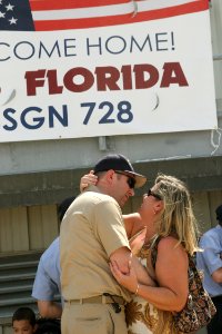 US Navy 090508-N-1841C-087 Chief Yeoman Ray Dannemiller, winner of the first kiss raffle, greets his wife as the guided-missile submarine USS Florida (SSGN 728) moors at Naval Submarine Base, Kings Bay