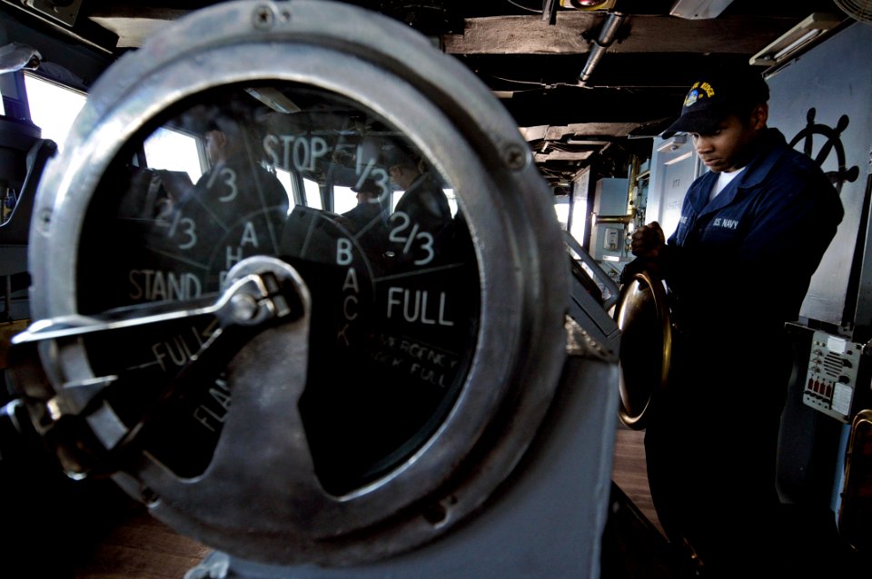 US Navy 090506-N-7478G-018 Seaman Raymond Lovelace, assigned to the amphibious command ship USS Blue Ridge (LCC 19), maintains a steady coarse