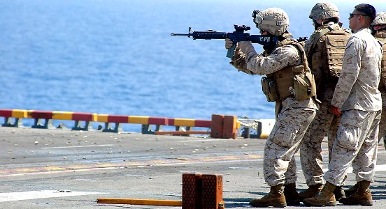 US Navy 090510-N-6410J-037 INDIAN OCEAN (May 10, 2009) Marines assigned to the 13th Marine Expeditionary Unit (13th MEU) embarked aboard the amphibious assault ship USS Boxer (LHD 4) fire at targets during small arms weapons tr