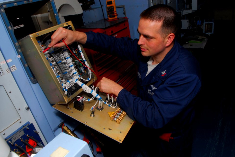 US Navy 090508-N-0096C-012 PACIFIC OCEAN (May 8, 2009) Aviation Electronic Technician 2nd Class Stanley Dickerson, from Odessa, Texas, troubleshoots a liquid cooling radiator unit