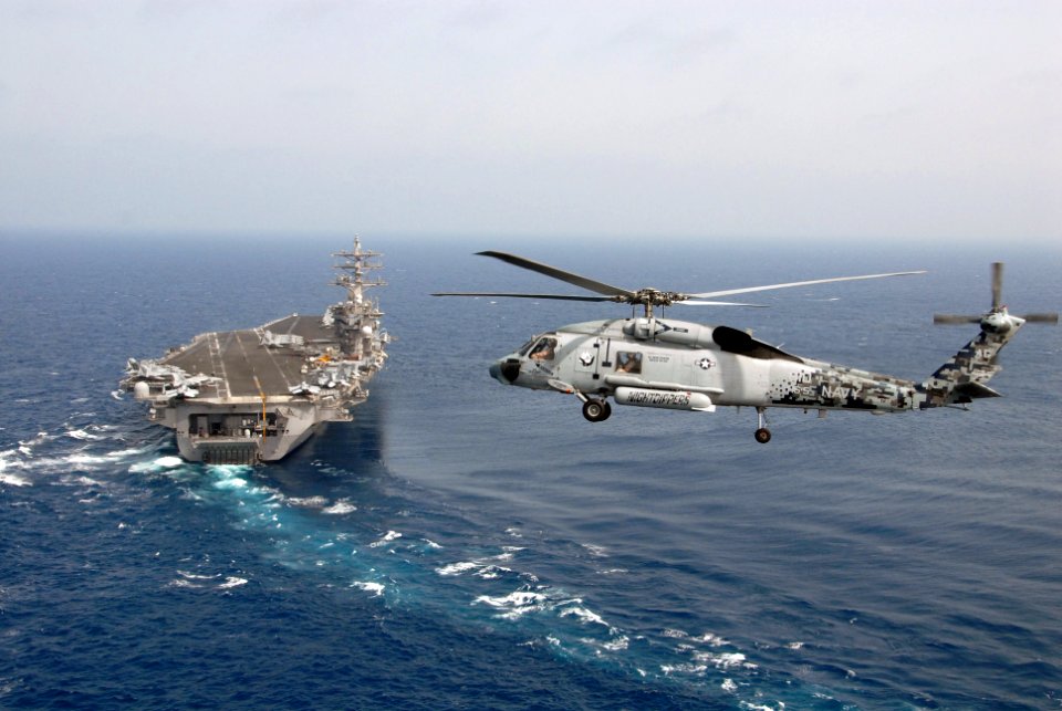US Navy 090509-N-9909C-515 An SH-60F Sea Hawk helicopter assigned to Helicopter Antisubmarine Squadron (HS) 5 flies in the vicinity of the aircraft carrier USS Dwight D. Eisenhower (CVN 69)