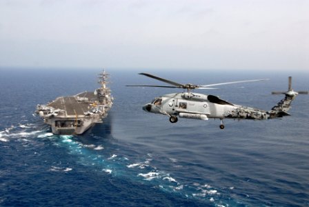 US Navy 090509-N-9909C-515 An SH-60F Sea Hawk helicopter assigned to Helicopter Antisubmarine Squadron (HS) 5 flies in the vicinity of the aircraft carrier USS Dwight D. Eisenhower (CVN 69)