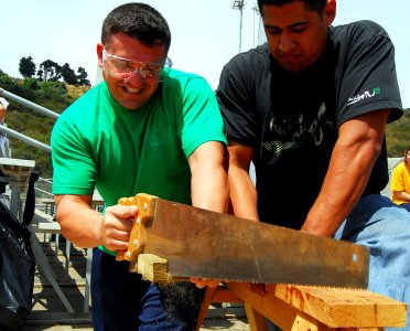 US Navy 090508-N-2183K-128 Builder 2nd Class Richard Falvo competes in a timed sawing contest during The Seabee Challenge competition at Naval Base Point Loma