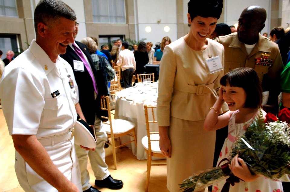 US Navy 090507-N-9818V-182 Master Chief Petty Officer of the Navy (MCPON) Rick West congratulates winner of the Military Spouse of the Year Tanya Queiro