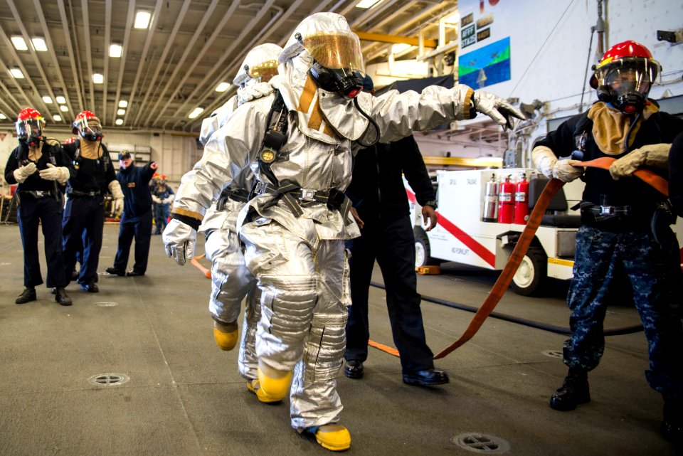 USS Bonhomme Richard (LHD 6) Air Department Sailors Combat Simulated Fire 170224-N-XT039-147