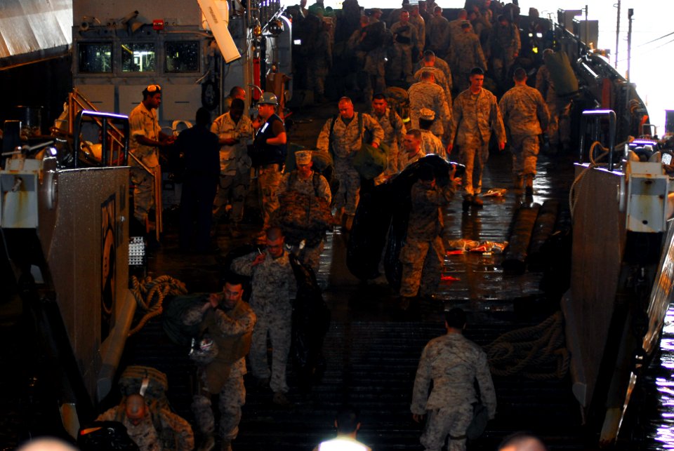US Navy 090514-N-3165S-087 Members of the 22d Marine Expeditionary Unit offload from a landing craft unit onto the multi-purpose amphibious assault ship USS Bataan (LHD 5)