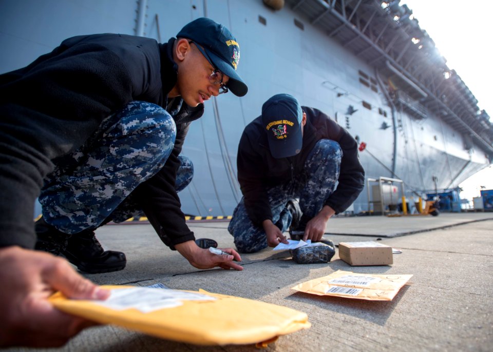 USS Bonhomme Richard (LHD 6) Mail Call 170103-N-TH560-010