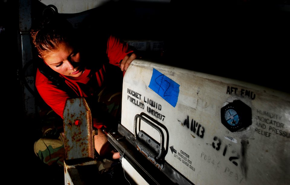 US Navy 090512-N-9928E-049 Aviation Ordnanceman Airman Shantee Lancour, from Milwaukee , Wis., tightens bolts on a missile container