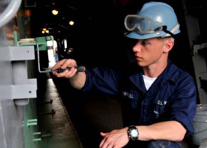US Navy 090511-N-2013O-011 YOKOSUKA, Japan (May 11, 2009) Operations Specialist Seaman Ronald Trandell, from Lapeer, Mich., paints a bulkhead aboard the Arleigh-Burke class guided-missile destroyer USS Lassen (DDG 82)