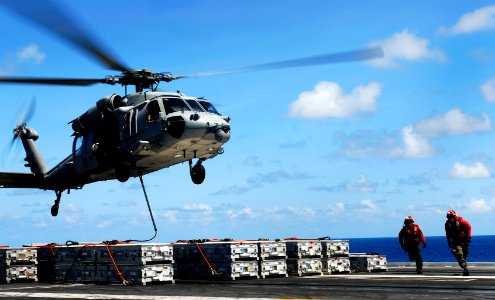 US Navy 090513-N-9928E-274 Aviation Ordnanceman 3rd Class Jason Scearce, left, from Callands, Va., and Aviation Ordnanceman 3rd Class August Dudley, from Albuquerque, N.M., clear an MH-60S Sea Hawk helicopter