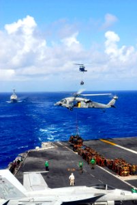 US Navy 090515-N-2475A-106 MH-60S Sea Hawk helicopters from the Eightballers of Helicopter Sea Combat Squadron (HSC) 8 and the Island Knights of Helicopter Sea Combat Squadron (HSC) 25 transfer pallets of supplies