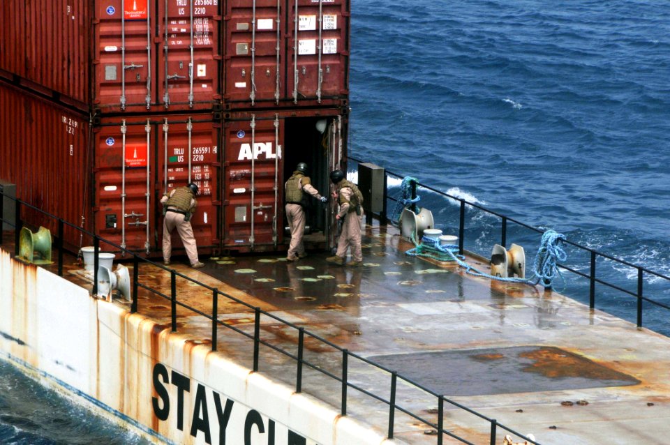 US Navy 090514-N-3946H-072 Explosive Ordnance Disposal (EOD) Technicians, attached to EOD Mobile Unit Eleven (EODMU-11) Platoon 1131, inspect shipping containers
