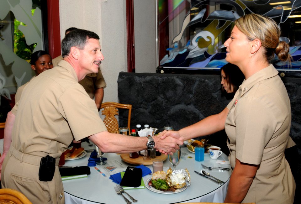 US Navy 090511-N-3666S-006 Vice Adm. Michael Vitale, commander, Naval Installations Command, meets with Gas Turbine System Technician (Mechanical) 3rd Class Alahnna Taylor, assigned to Naval Station Pearl Harbor, during lunch a