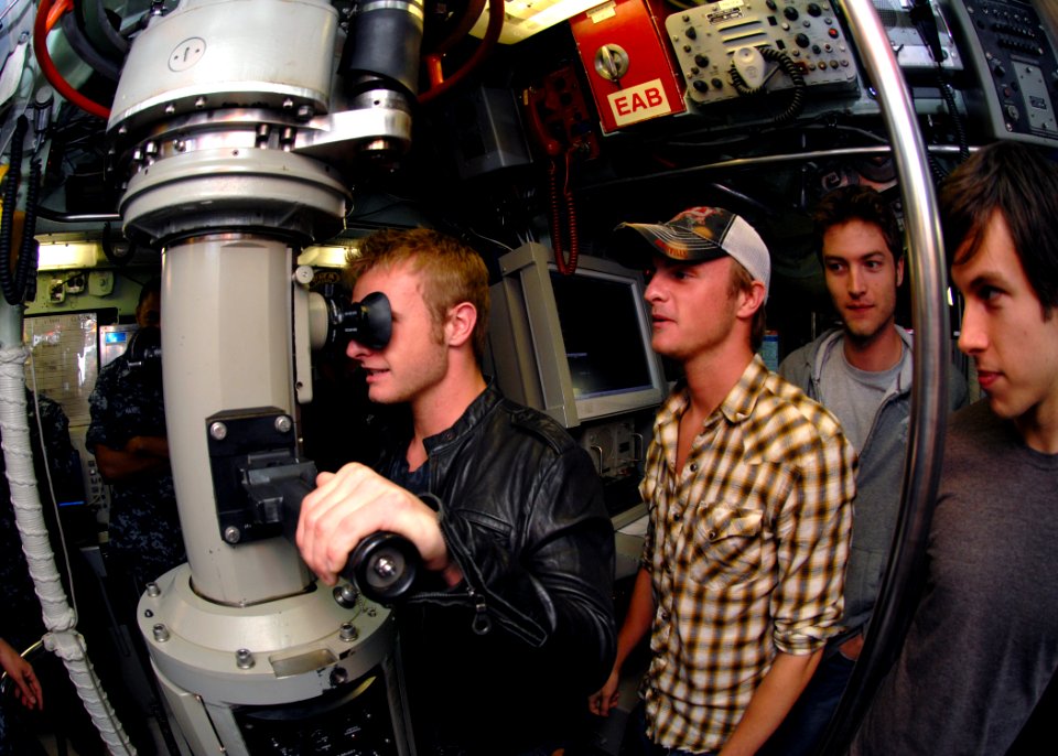 US Navy 090511-N-7705S-031 NORFOLK (May 11, 2009) Josh Carter of the country music band The Carter Twins peers through the periscope of the Los Angeles-class attack submarine USS Norfolk (SSN 714) as his twin brother Josh looks