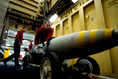 US Navy 090516-N-3541A-063 Aviation Ordnanceman Airman William Renz, right, from Heyburn, Ida., loads a BLU-111 bomb onto a lower stage weapons elevator aboard the aircraft carrier USS John C. Stennis (CVN 74)
