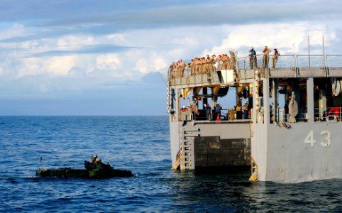 US Navy 090515-N-5345W-291 An amphibious assault vehicle from the 22nd Marine Expeditionary Unit (22 MEU) prepares to enter the well deck of the amphibious dock landing ship USS Fort McHenry (LSD 43)