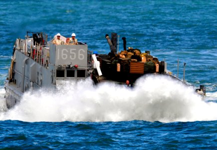US Navy 090515-N-5345W-206 A landing craft unit from Assault Craft Unit (ACU) 2 crashes through the surf as it approaches the well deck of the Whidbey Island-class amphibious dock landing ship USS Fort McHenry (LSD 43) photo