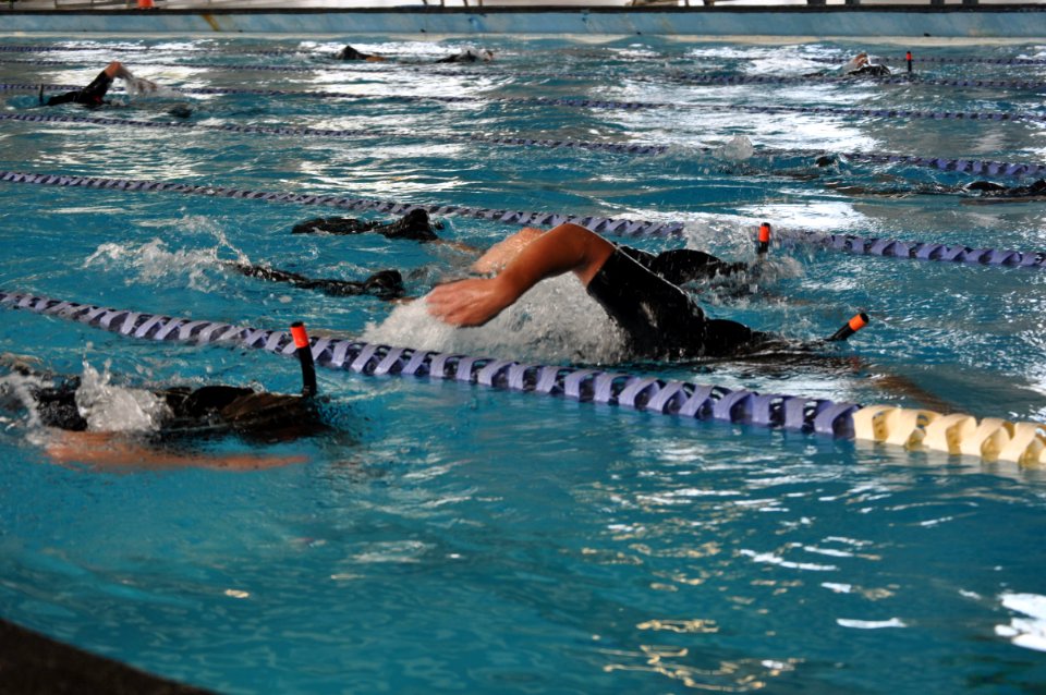 US Navy 090514-N-4124C-002 Surface Line Week competitors race towards the finish line during the swim portion of a search and rescue (SAR) competition