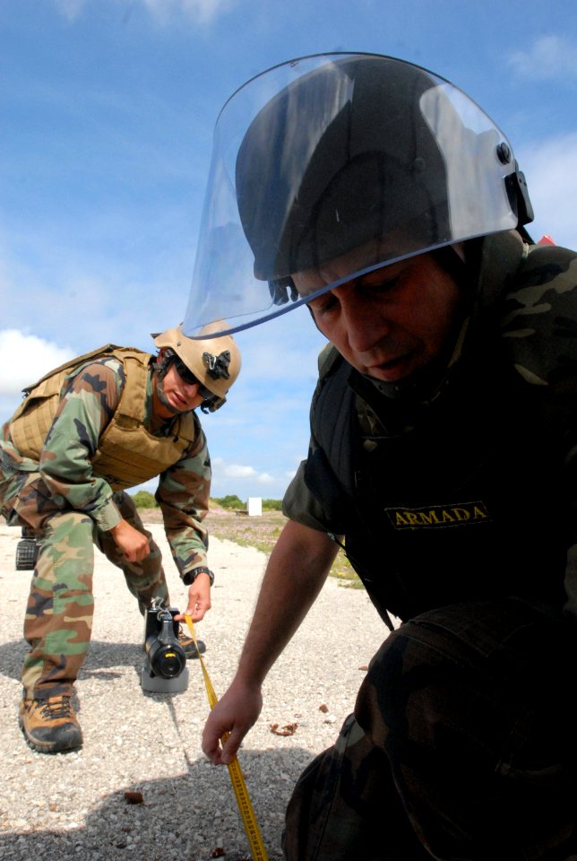US Navy 090514-N-3289C-120 Technician 1st Class Luigi Mendoza, assigned to Explosive Ordnance Disposal Mobile Unit (EODMU) 8 Det. Europe, measure distance from a simulated Improvised Explosive Device