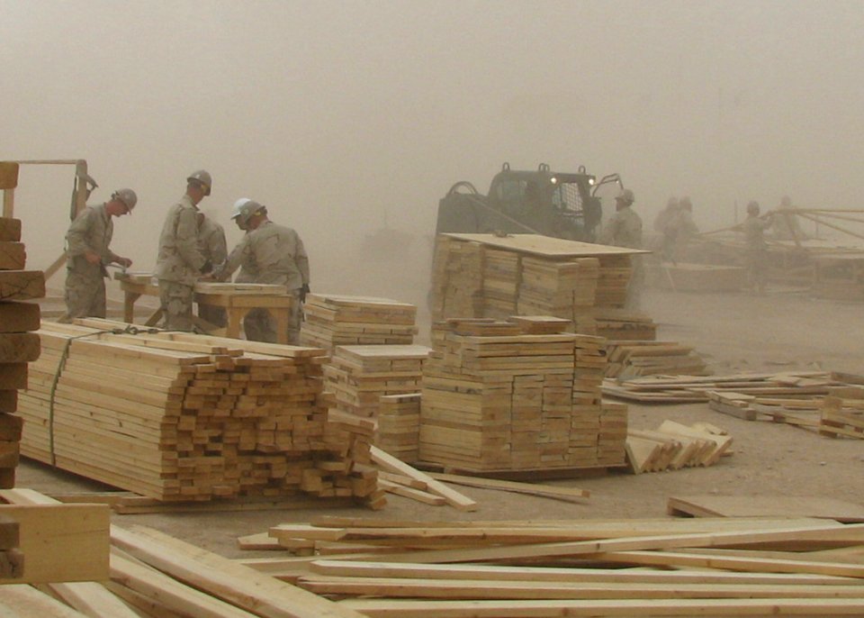 US Navy 090518-N-9410R-018 Seabees assigned to Naval Mobile Construction Battalion (NMCB) 5 work through a sand storm at the Barley Company Pre-Fabrication Yard at Camp Natasha