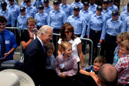 US Navy 090514-N-9132C-213 Vice President Joe Biden poses for a picture after addressing Sailors of Carrier Strike Group 7 on the pier in front of Nimitz-class aircraft carrier USS Ronald Reagan (CVN 76)