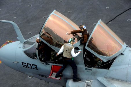 US Navy 090515-N-3946H-028 Sailors assigned to the Black Ravens of Electronic Attack Squadron (VAQ) 135 clean the cockpit windows of an EA-6B Prowler aboard the aircraft carrier USS Nimitz (CVN 68)
