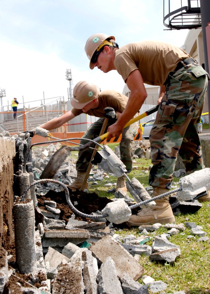 US Navy 090518-N-9520G-053 Builder 3rd Class Bryan Fenton emove a baseball dugout during a construction renovation at Commander, Fleet Activities Yokosuka