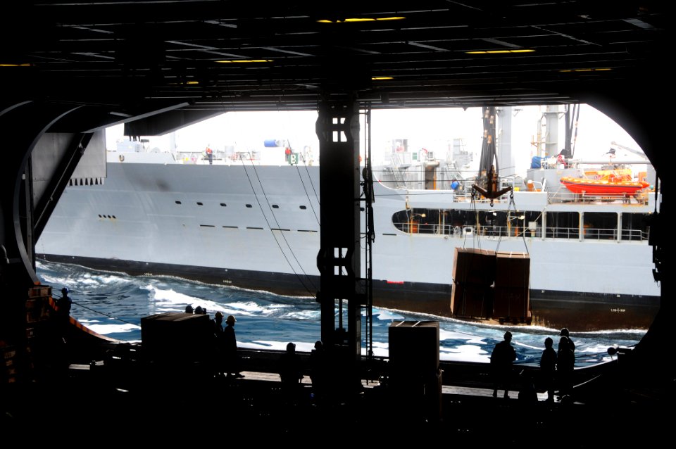 US Navy 090516-N-3946H-019 Sailors aboard the aircraft carrier USS Nimitz (CVN 68) offload boxes of supplies during a replenishment-at-sea with the Military Sealift Command fleet replenishment oiler USNS Yukon (T-AO 202)