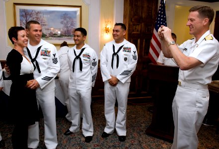 US Navy 090521-N-1722M-113 Vice Adm. Dirk Debbink, Chief of Navy Reserve, takes a photograph of Naval Aircrewman 1st Class William J. Frost, assigned to Helicopter Sea Combat Squadron (HSC) 85, and his wife
