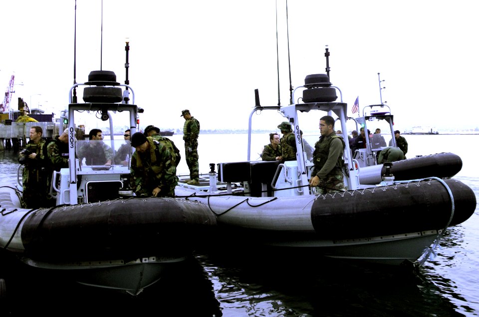 US Navy 090521-N-3570S-002 A team of U.S. Navy search and salvage specialists assigned to Explosive Ordnance Disposal Mobile Unit (EODMU) 1 prepare three 11-meter rigid-hulled inflatable boats to continue search efforts for a d