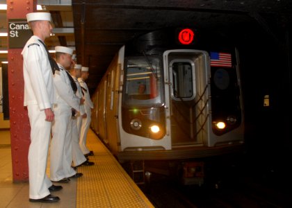 US Navy 090521-N-4856C-266 Sailors assigned to Helicopter Mine Countermeasures Squadron (HM) 14 wait for a subway car at the Canal Street subway station in Manhattan during Fleet Week New York City 2009