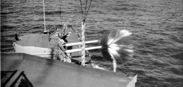 USS Brownson (DD-868) fires its forward 127 mm guns, in 1975
