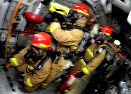 US Navy 090519-N-7280V-047 Sailors participate in a main space fire drill aboard the amphibious command ship USS Blue Ridge (LCC 19)