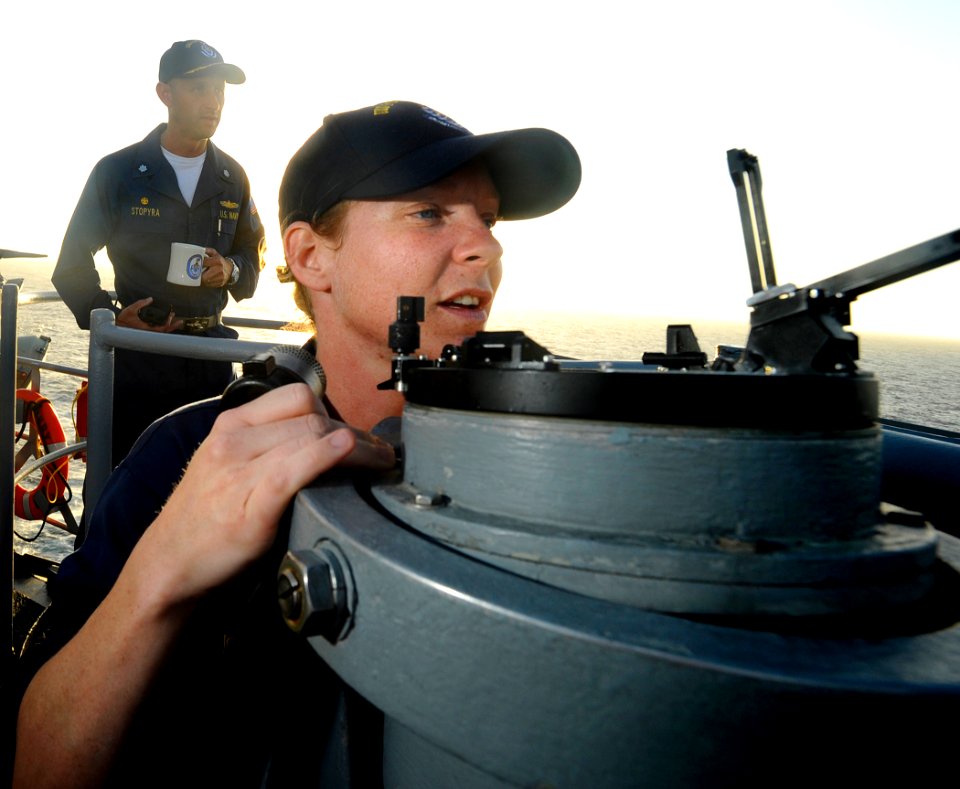 US Navy 090518-N-5345W-082 Supervised by her commanding officer, Cmdr. Chris Stopyra, Ensign Amee Johnson, the weapons officer aboard the amphibious dock landing ship USS Fort McHenry (LSD 43), looks over a magnetic compass