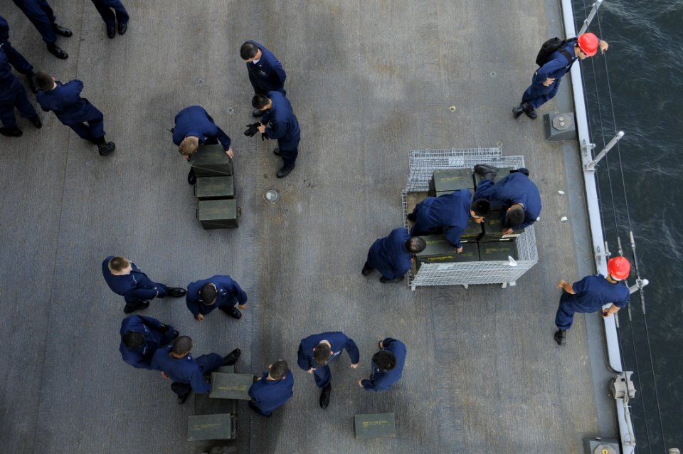 US Navy 090520-N-7478G-150 Sailors assigned to the amphibious command ship USS Blue Ridge (LCC 19) stage ammunition before an offload