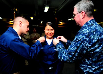 US Navy 090521-N-3946H-023 Rear Adm. John Miller, commander of Carrier Strike Group 11, and Chief Information Systems Technician Jason Sabater pin 1st Class Petty Officer insignia on Information Systems Technician 1st Class Yes