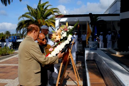 US Navy 090521-N-1825E-320 Carlos Soto, left, and Henry Marquez, members of the Naval Station Rota Retired American Military Iberian Council, place a wreath during a Memorial Day ceremony at the base Chapel