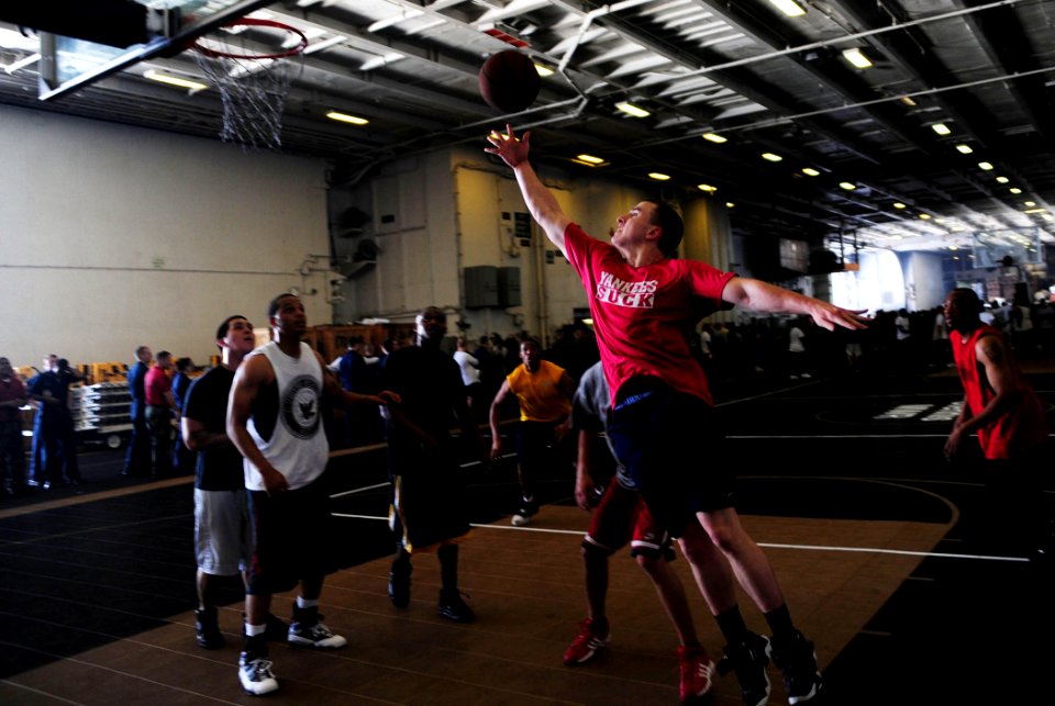 US Navy 090525-N-0684R-037 Master-at-Arms 3rd Class Kevin Murphy, from Boston, makes a jump shot during a morale, welfare and recreation-sponsored 'Fun Day' in the hangar bay aboard the aircraft carrier USS John C. Stennis (CVN