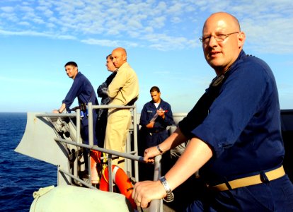 US Navy 090523-N-5345W-324 Lt. Cmdr. Brian Goldschmidt, right, executive officer of the amphibious dock landing ship USS Fort McHenry (LSD 43), watches from outside the pilothouse